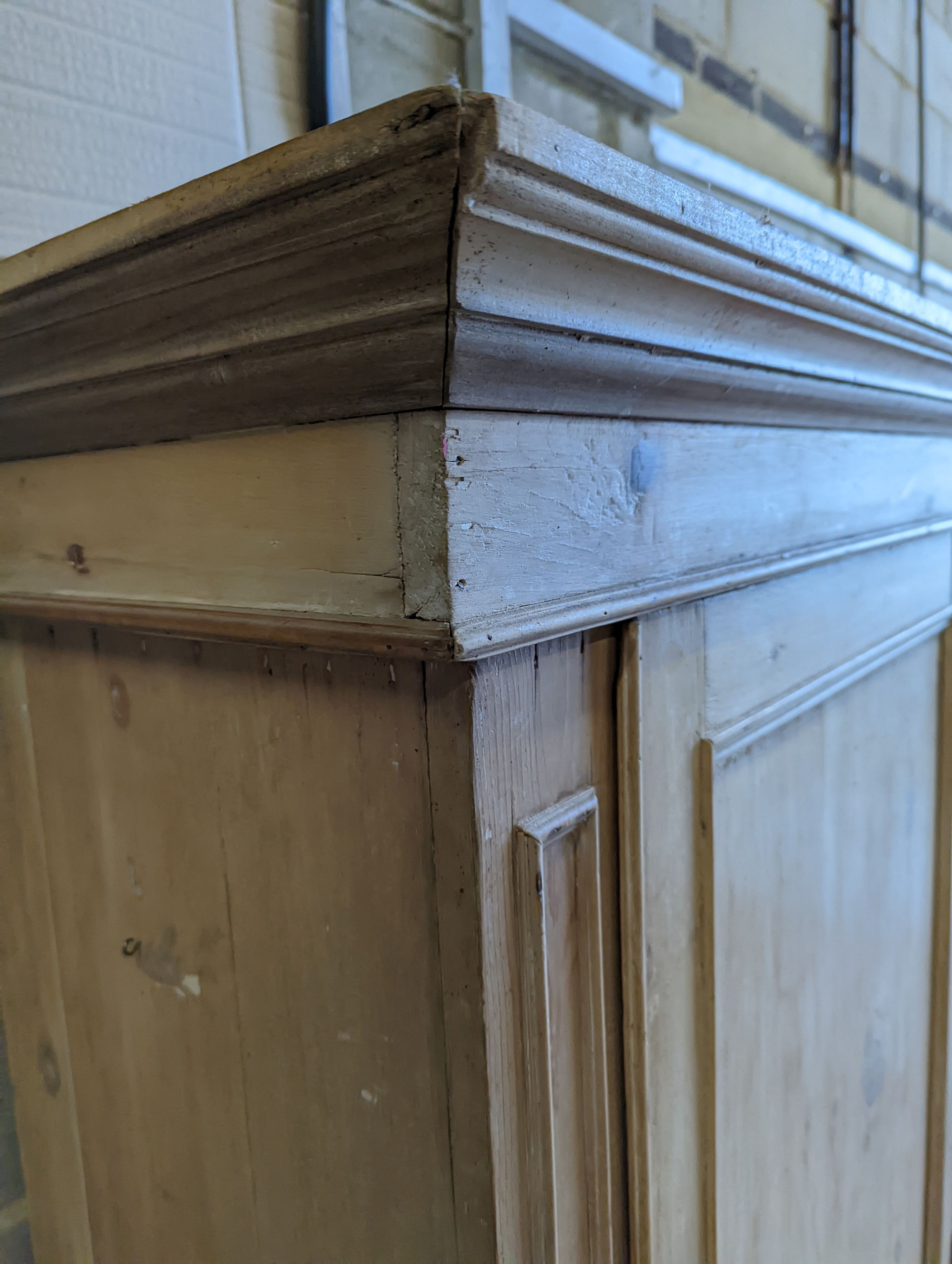 An Edwardian pine kitchen cupboard with five drawer base, width 94cm, height 193cm